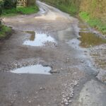 Pots,Holes,In,A,Narrow,Country,Lane